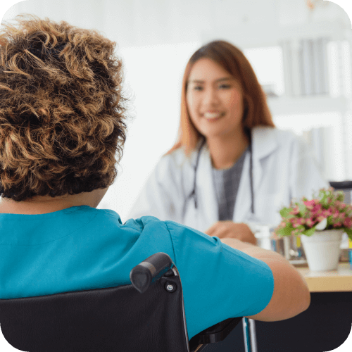 Female healthcare consulting a person with disability